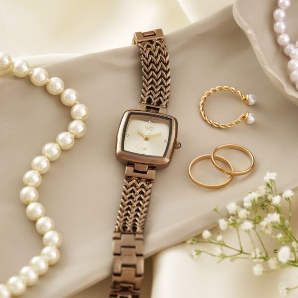 Fastrack Vyb Showstopper Quartz Analog Golden Dial Brown Metal Strap Watch For Girls - image number 0