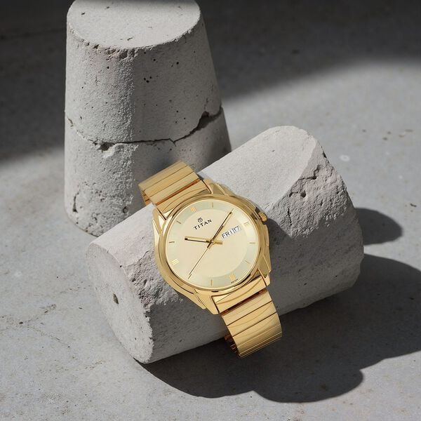 Titan Quartz Analog with Day and Date Champagne Dial Golden Stainless Steel Strap Watch For Men - image number 0